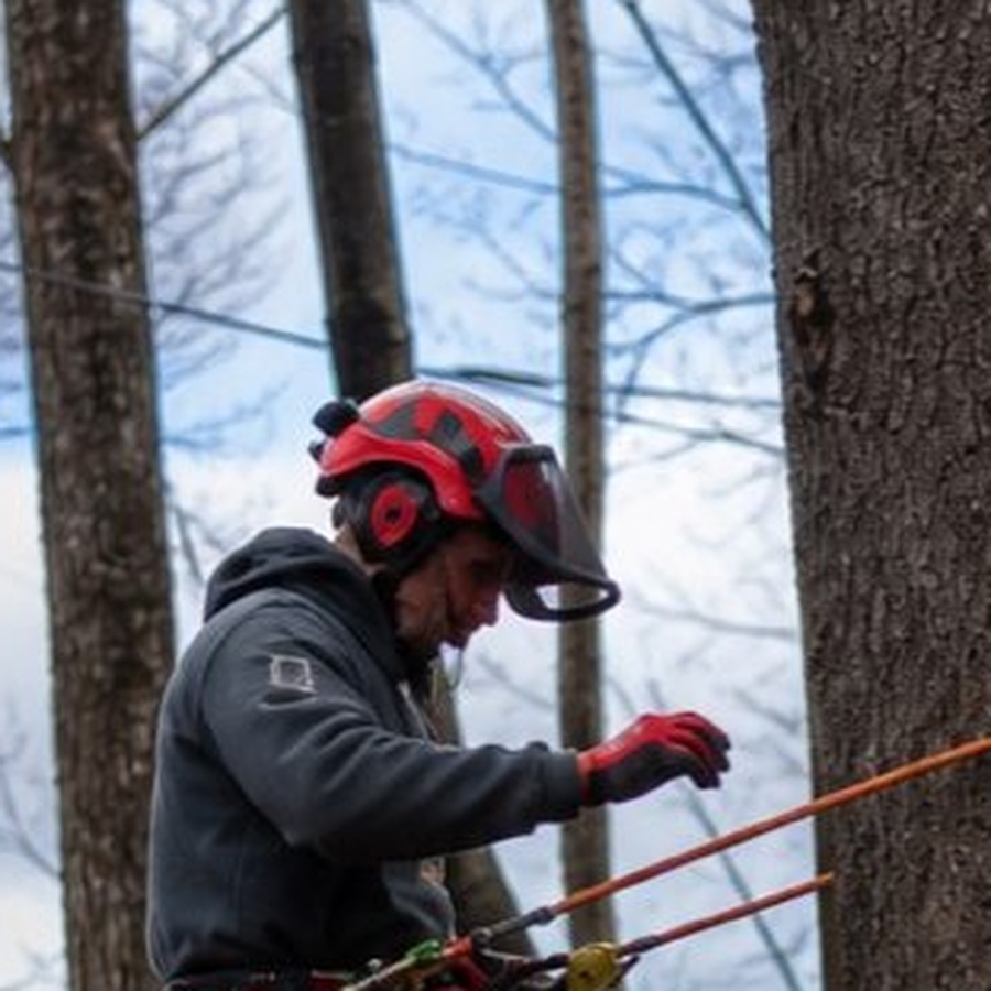 Jeff climbing on site in full gear — General Contractor, Granite Getaways
